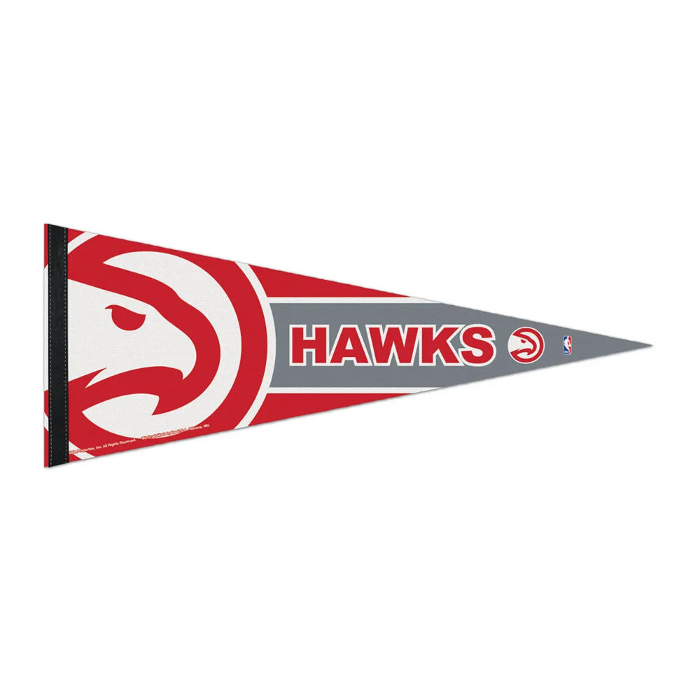 The NBA Premium Felt Pennant showcases the Atlanta Hawks team logo with bold red, white, and gray accents, displaying "HAWKS" in large letters along with smaller logos down the length of the triangular pennant.