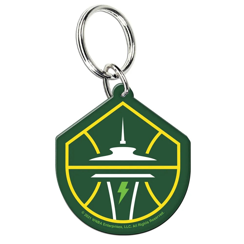 The WNBA Keychain, featuring the Seattle Storm logo with a yellow basketball outline, Space Needle, and green lightning bolt, is the perfect accessory for any basketball fan—pair it with your Los Angeles Sparks keychain.