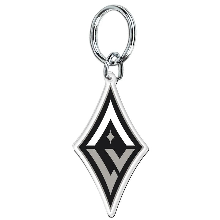 The WNBA Keychain features a diamond-shaped metal pendant with a silver ring. Its black, white, and gray geometric design is inspired by the Los Angeles Sparks and Staples Center—perfect for any basketball fan’s accessories.