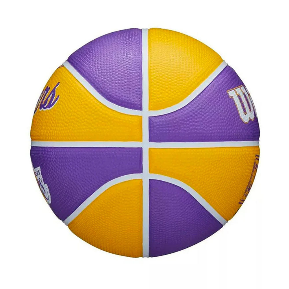The Wilson NBA Los Angeles Lakers Mini Basketball features alternating purple and yellow panels with white lines, plus white and purple lettering. This size 3 basketball is perfect for kids.