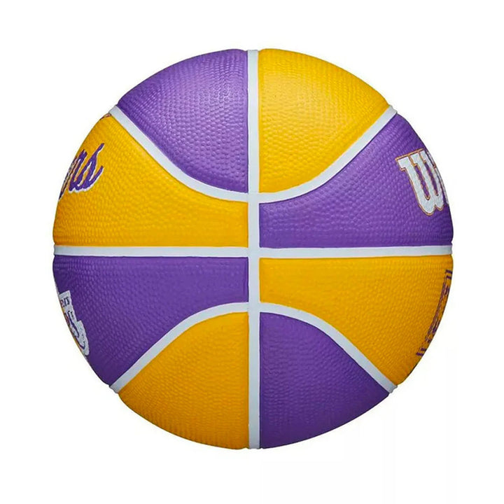 The Wilson NBA Los Angeles Lakers Mini Basketball features alternating purple and yellow panels with white lines, plus white and purple lettering. This size 3 basketball is perfect for kids.