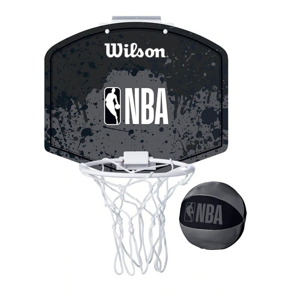 The Wilson NBA Mini Hoop Door Set w/Ball includes a black and gray backboard with white Wilson and NBA logos, a white net, and a matching black and gray mini basketball featuring the NBA logo.
