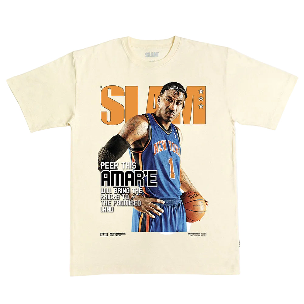 Show your hoops fandom in the SLAM Hardwood Classics Cover T-Shirt, Amar’e Stoudemire. This cream tee features a dynamic graphic of a basketball player wearing a blue New York Knicks jersey inspired by Amar’e Stoudemire, with bold orange SLAM text in the background. Smaller lettering adds: “Peep this Amare will bring the Knicks to the promised land,” making this shirt truly iconic for any Knicks fan.