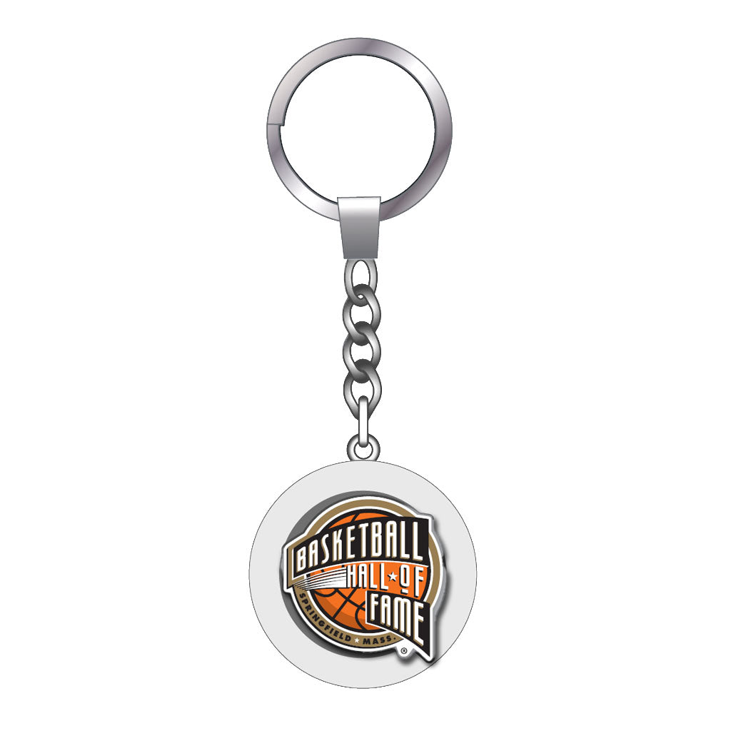 The Basketball Hall of Fame Keychain is a silver souvenir featuring a round pendant with the Hall of Fame logo and bold lettering—a perfect basketball accessory for fans.