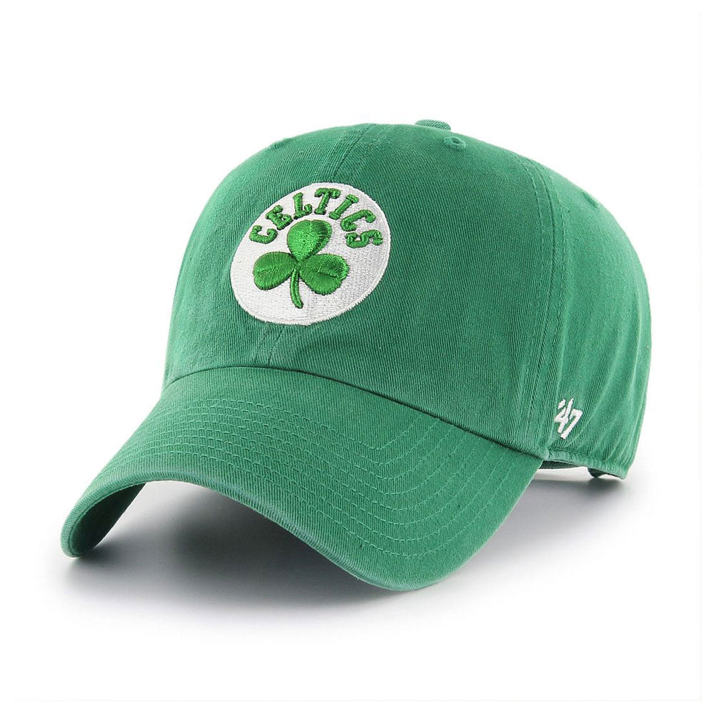The Boston Celtics '47 Clean Up Cap is a green unstructured cap with a curved brim, shamrock logo on the front, white embroidered 47 on the side, and an adjustable strapback for comfort.