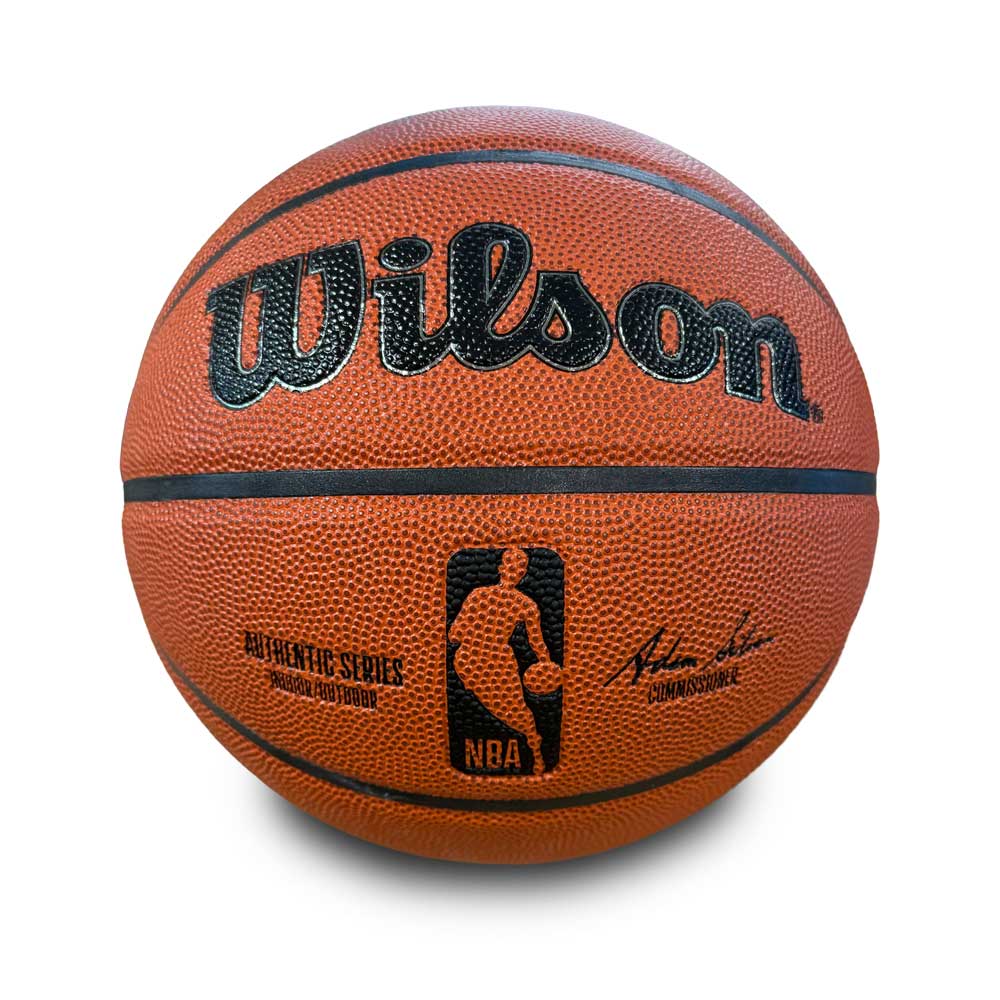 The Basketball Hall of Fame x Wilson NBA Replica Basketball features a textured orange surface, black seams, the NBA logo, a signature, and "Authentic Series" on the front, shown against a white background.