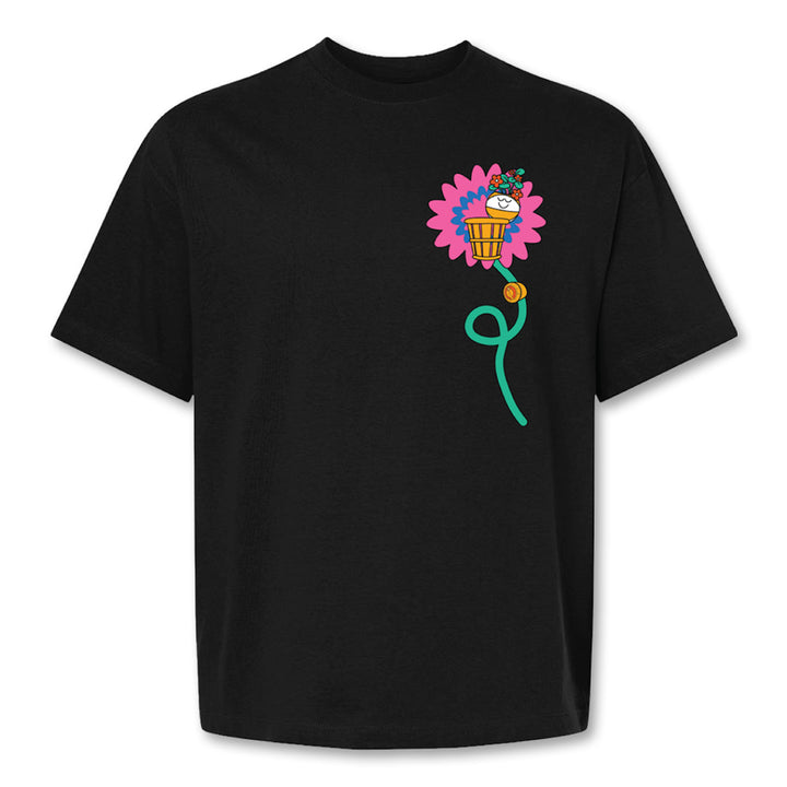 The Basketball Hall of Fame Buckets in Bloom T-Shirt features a large pink flower with a cartoon cupcake at its center and a green stem extending down the front, inspired by Fiorella Granda’s artwork.