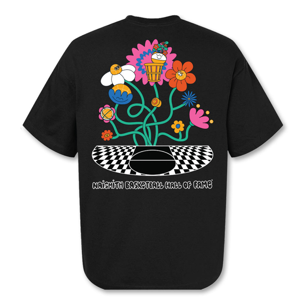 The Basketball Hall of Fame Buckets in Bloom T-Shirt showcases Fiorella Granda's colorful cartoon flowers on a checkered basketball, with the Naismith Basketball Hall of Fame text below—perfect for any basketball fan.
