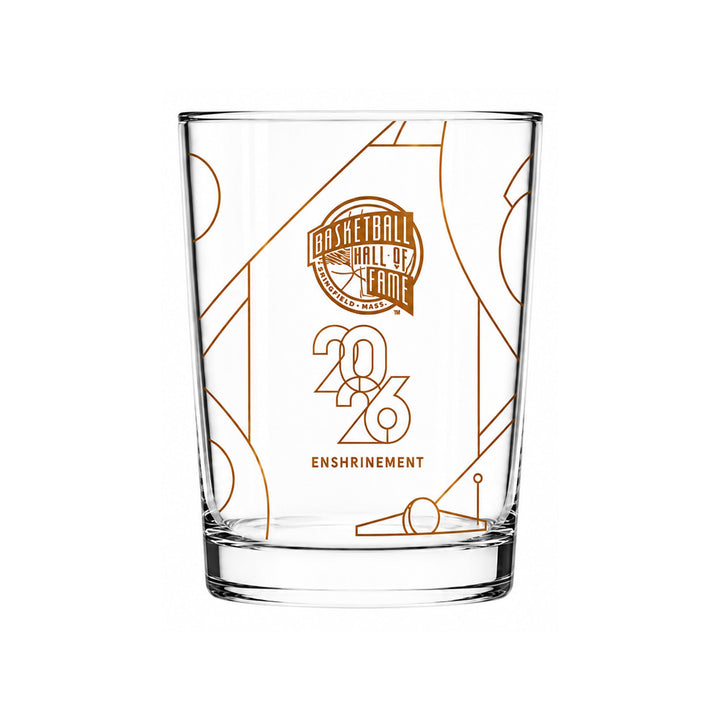 The Basketball Hall of Fame® 2026 Enshrinement Rocks Glass showcases orange line art, the official 2026 logo, “2026,” and “Enshrinement” on the front, making it a standout addition for any basketball collectibles fan.