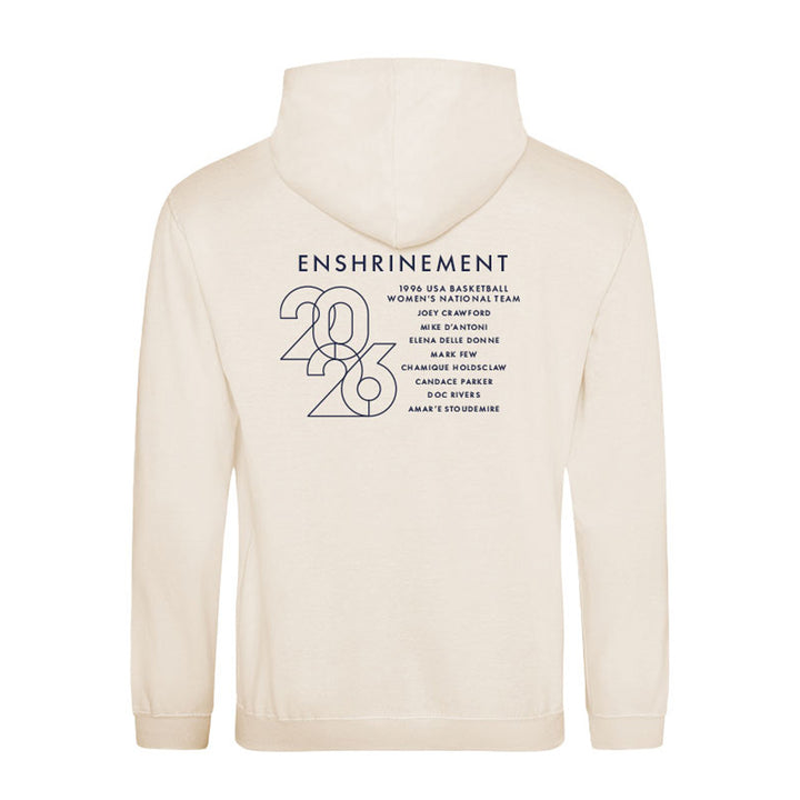 The Basketball Hall of Fame® 2026 Enshrinement Hooded Sweatshirt is cream-colored with "Enshrinement 2026," a list of names, and bold 2026 numbers on the back. It features a drawstring hood and long sleeves to honor the tradition.