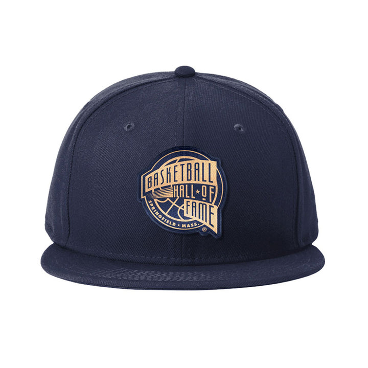 Show your love for the game with the Basketball Hall of Fame® Building Patch Cap, a navy blue snapback featuring a flat brim and iconic logo patch—ideal for sports fans.