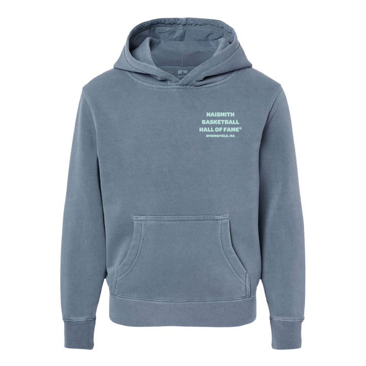 The Basketball Hall of Fame® Dr. Naismith Playmaker Youth Hooded Sweatshirt is a blue basketball hoodie for youth, featuring a front pocket and hood. The left chest displays white text reading “Naismith Basketball Hall of Fame, Springfield, MA.” This sweatshirt has a plain design with no additional visible patterns or graphics.