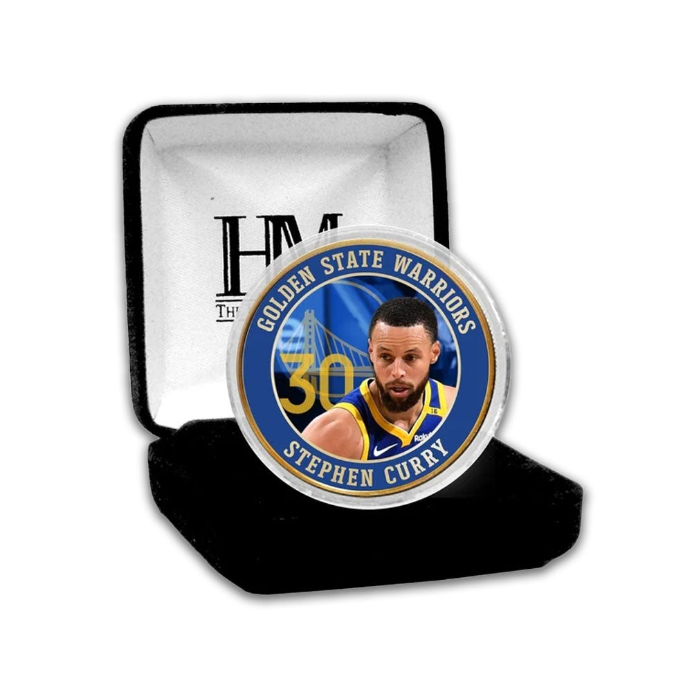 The NBA Golden State Warriors Steph Curry Bronze Commemorative Coin features Curry in his team jersey, number 30, and the team name on a blue background, presented in a black velvet case—an ideal collector's item.