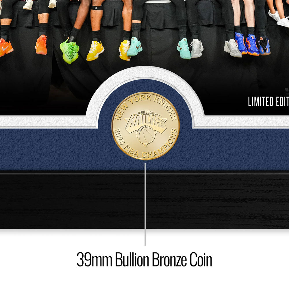 A close-up of the 2026 NBA Champions New York Knicks Celebration Bronze Coin Photo Mint, displayed below vibrant basketball shoes. The text "LIMITED EDITION" highlights this exclusive collectible.