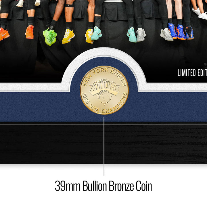 A close-up of the 2026 NBA Champions New York Knicks Celebration Bronze Coin Photo Mint, displayed below vibrant basketball shoes. The text "LIMITED EDITION" highlights this exclusive collectible.
