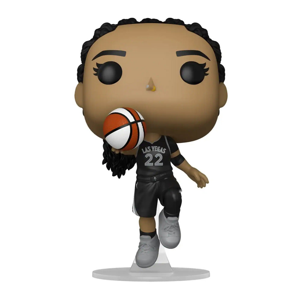 The Funko WNBA Las Vegas Aces POP! A'ja Wilson vinyl figure features her in a black jersey, number 22, holding a basketball and posed mid-shot on a clear stand.