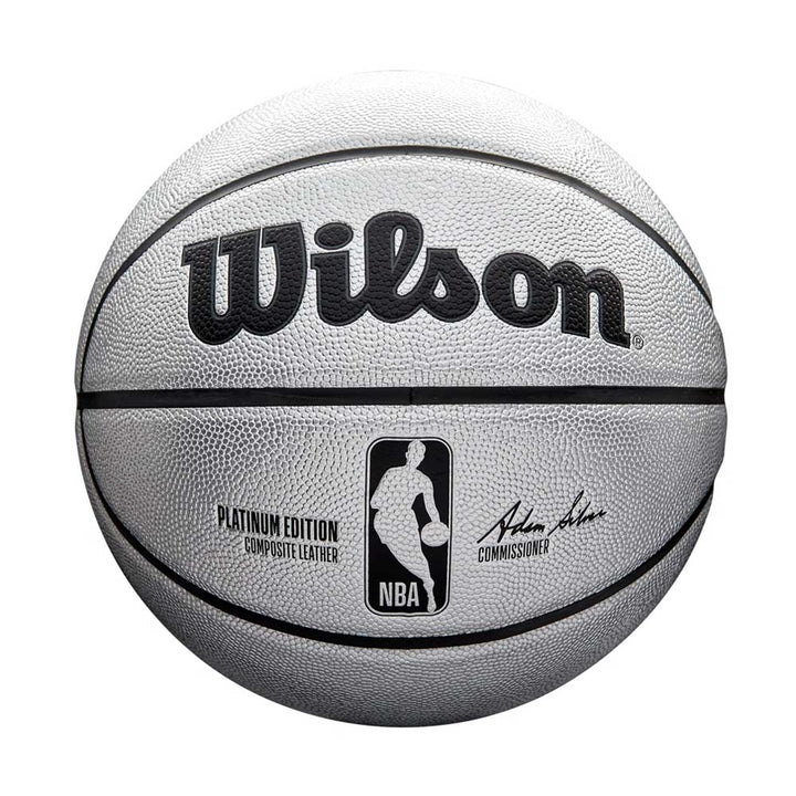 The Wilson NBA Platinum Edition Basketball in silver features the NBA logo, PLATINUM EDITION Composite Leather text, and the commissioner's black signature, providing exceptional grip for premium play.