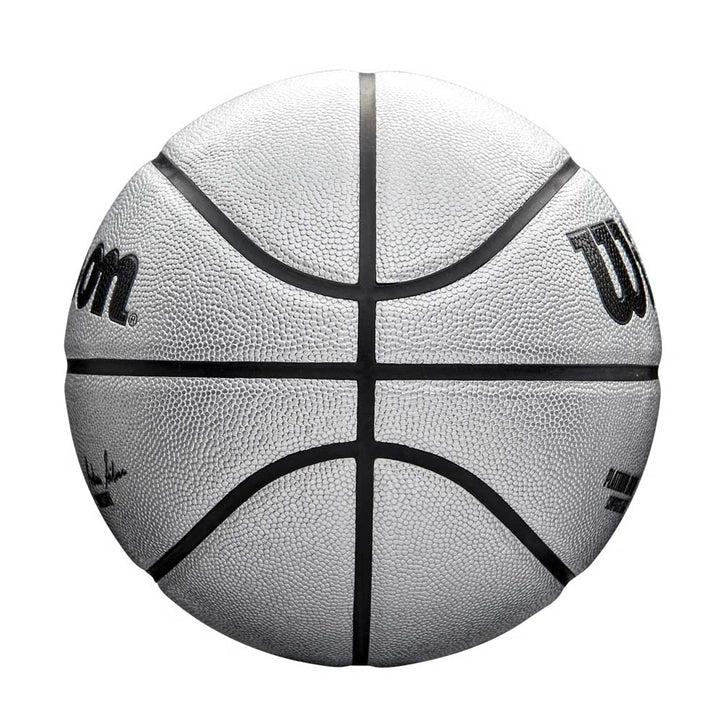 The Wilson NBA Platinum Edition Basketball, featuring the Wilson logo and black lines, is shown from above on a white background. This premium basketball provides exceptional grip for top-level performance.
