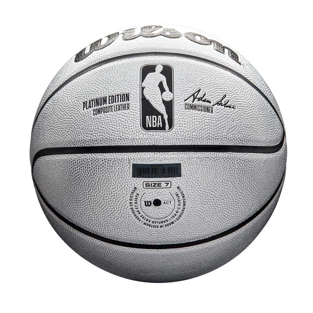 The Wilson NBA Platinum Edition Basketball, in white with black lines, features the NBA logo, Adam Silver’s signature, Platinum Edition Composite Leather, Size 7 marking on the front, and offers enhanced grip for premium performance.