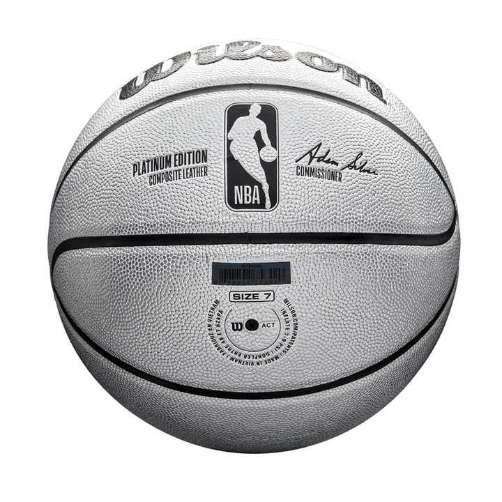 The Wilson NBA Platinum Edition Basketball, in white with black lines, features the NBA logo, Adam Silver’s signature, Platinum Edition Composite Leather, Size 7 marking on the front, and offers enhanced grip for premium performance.