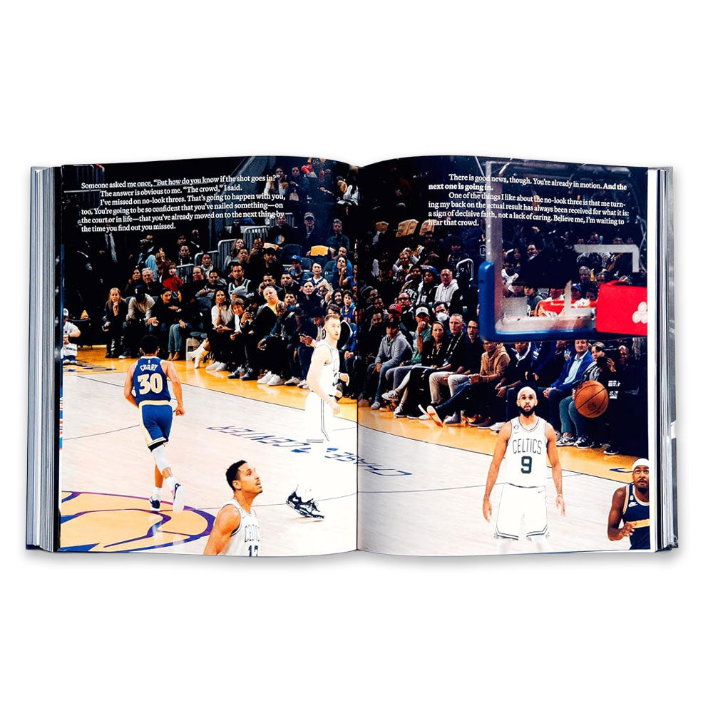 The Shot Ready book, inspired by the philosophy of success, features a scene where Golden State Warriors and Boston Celtics players play basketball as the audience watches, with a Celtics player in a Shot Ready stance shooting at the hoop.