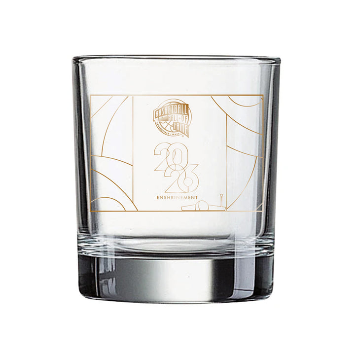Celebrate the historic 2026 Enshrinement with the Basketball Hall of Fame® 2026 Enshrinement Rocks Glass, featuring a clear design accented by geometric lines and an elegant gold logo on the front—perfect for fans and collectors seeking to commemorate this special basketball milestone.