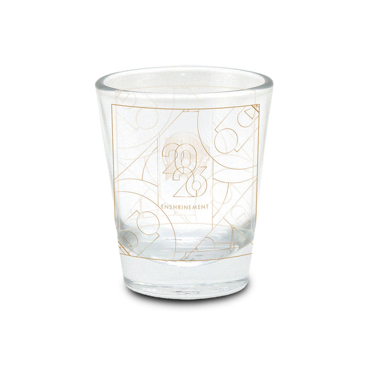 Showcase your love for the game with the Basketball Hall of Fame® 2026 Enshrinement Shot Glass. This clear glass shot glass features a striking gold geometric design and "2026 Enshrinement" printed on the front. Overlapping basketball motifs in the background create a unique and eye-catching look, making it an excellent addition to any basketball collectibles display. Celebrate basketball history with this must-have keepsake, perfect for fans and collectors alike.