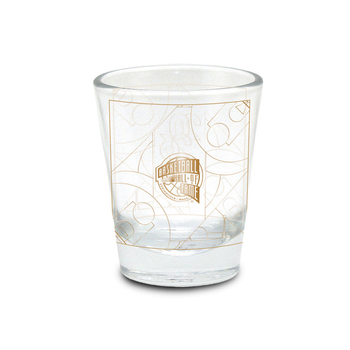 Show your passion for the game with the Basketball Hall of Fame® 2026 Enshrinement Shot Glass. This clear glass collectible features a gold Hall of Fame logo and basketball court lines printed on the outside, photographed against a white background—an essential addition for basketball fans and collectors looking forward to the 2026 Enshrinement.
