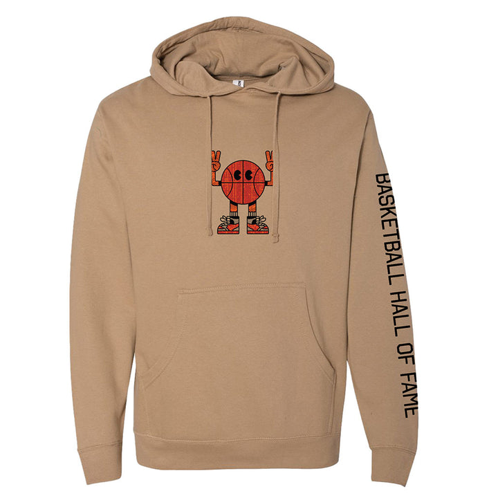 The Basketball Hall of Fame® Basketball Man Hooded Sweatshirt is tan with a cartoon basketball character making peace signs on the chest, a front pocket, and "BASKETBALL HALL OF FAME" printed vertically in black on the right sleeve.