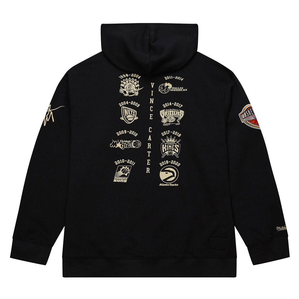 The Basketball Hall of Fame Vince Carter Hooded Sweatshirt features gold team logos and years on the back, “Vince Carter” vertically in the center, a gold signature on the right sleeve, and a round left patch—perfect for fans.
